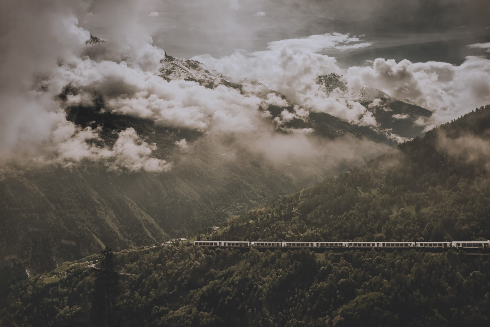 Clouds breaking over a mountain ridge